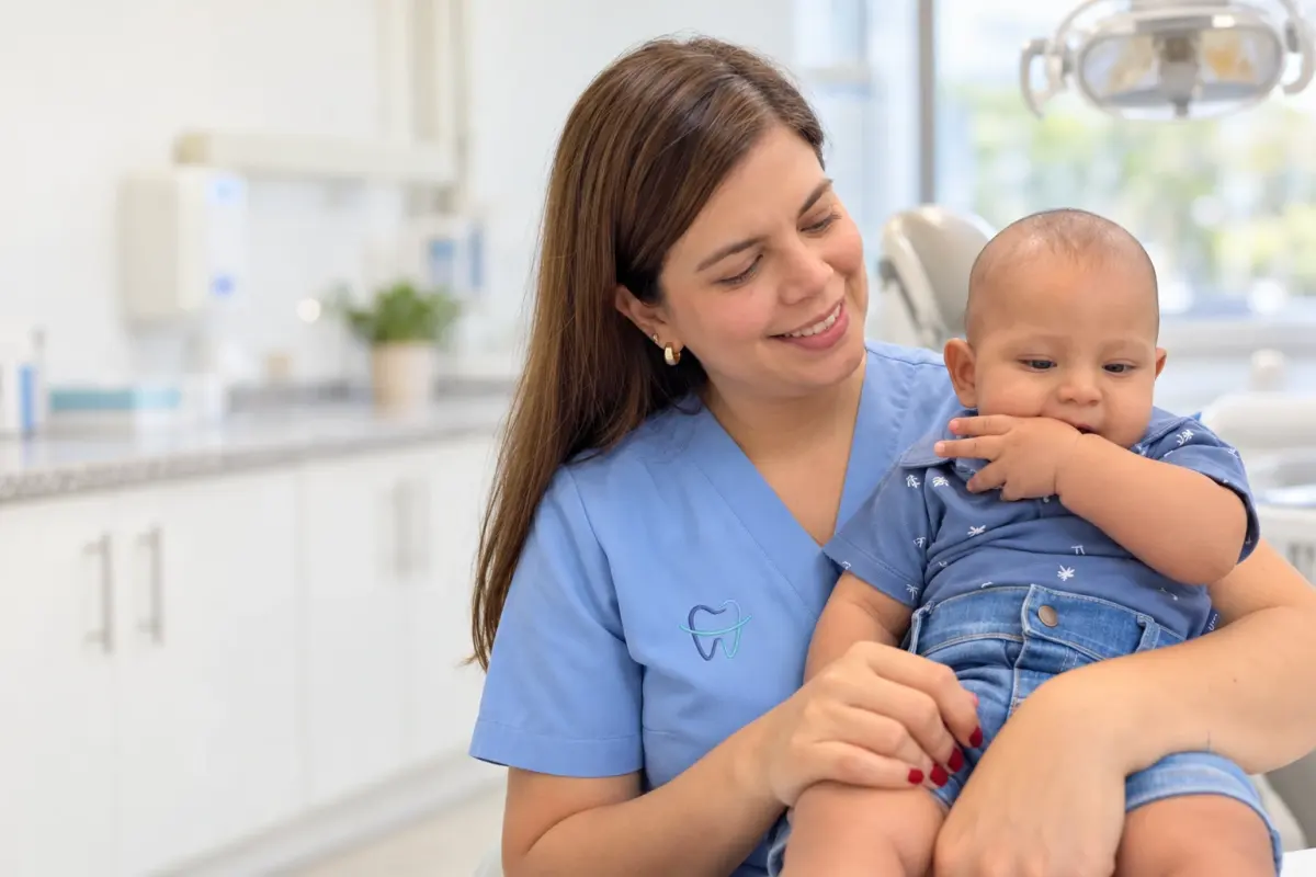 Dr. Kelly Palacio with a child at her office